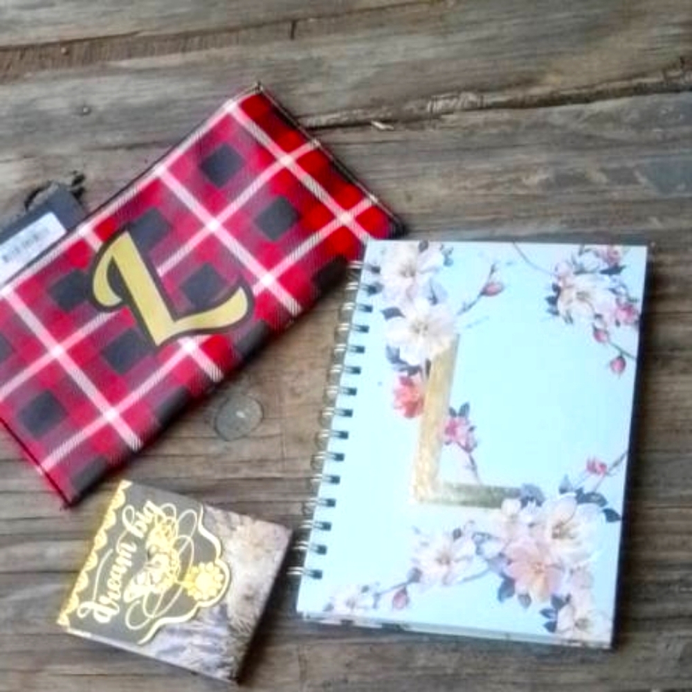 A bag and 1 mini notepad and one medium size